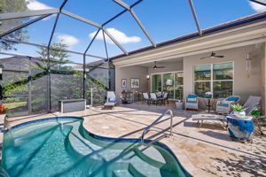 Here you are able to see the stair entry, and surrounding shelf seating in this pool! Auto-fill feature present in pool. The 2 windows are in the breakfast nook.