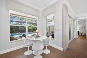 THREE windows from which to enjoy your fab pool area in this breakfast nook! Custom cornices present. Enjoy your morning coffee here!