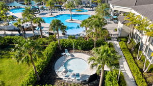 Drone /aerial view of the grandkids' pool, resort pool with beach entry, resistance pool, and lap pool! Truly like living at a resort!