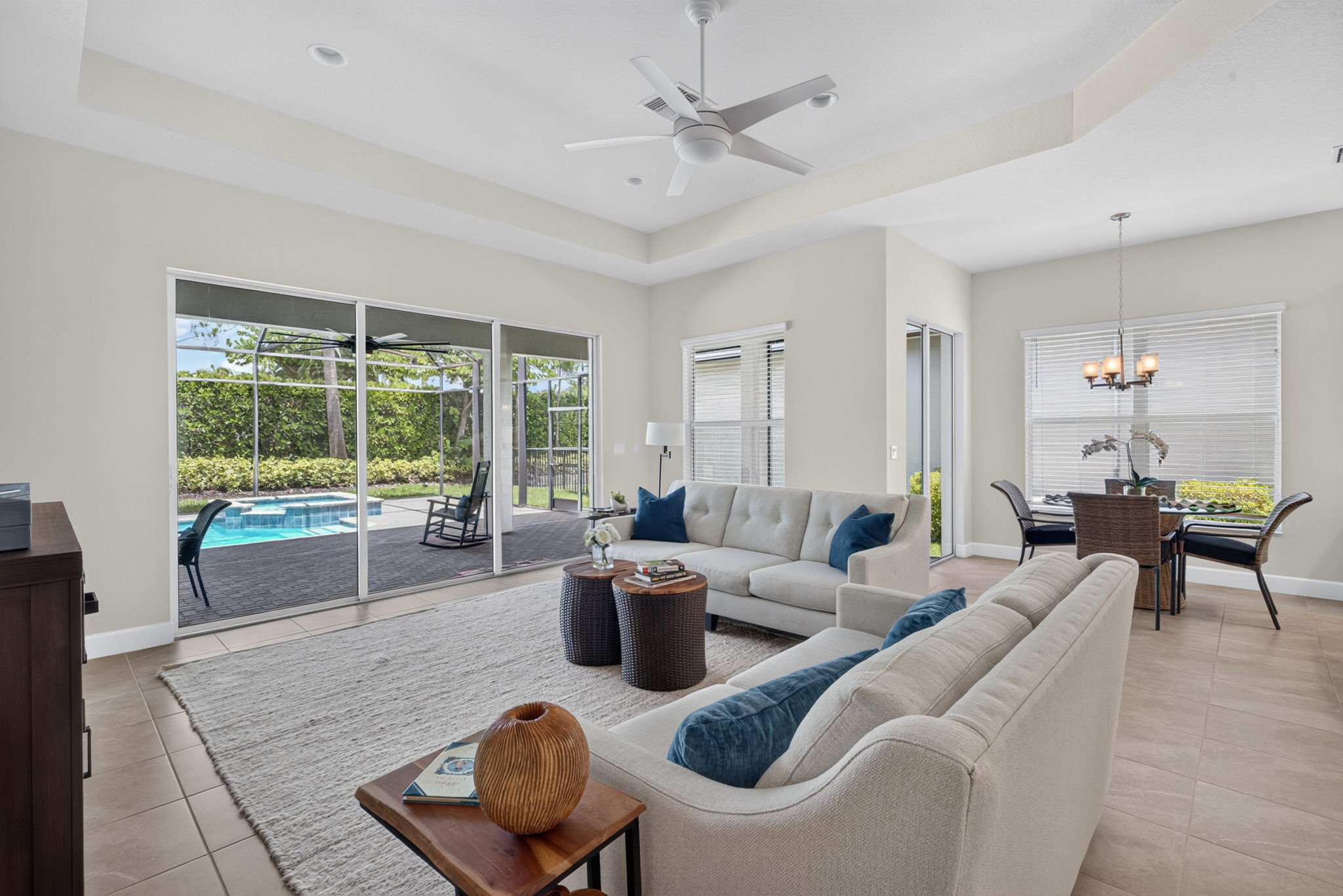 The generous sized great room features a tray ceiling, 3 sliders plus 2 windows! Private rear yard, too!