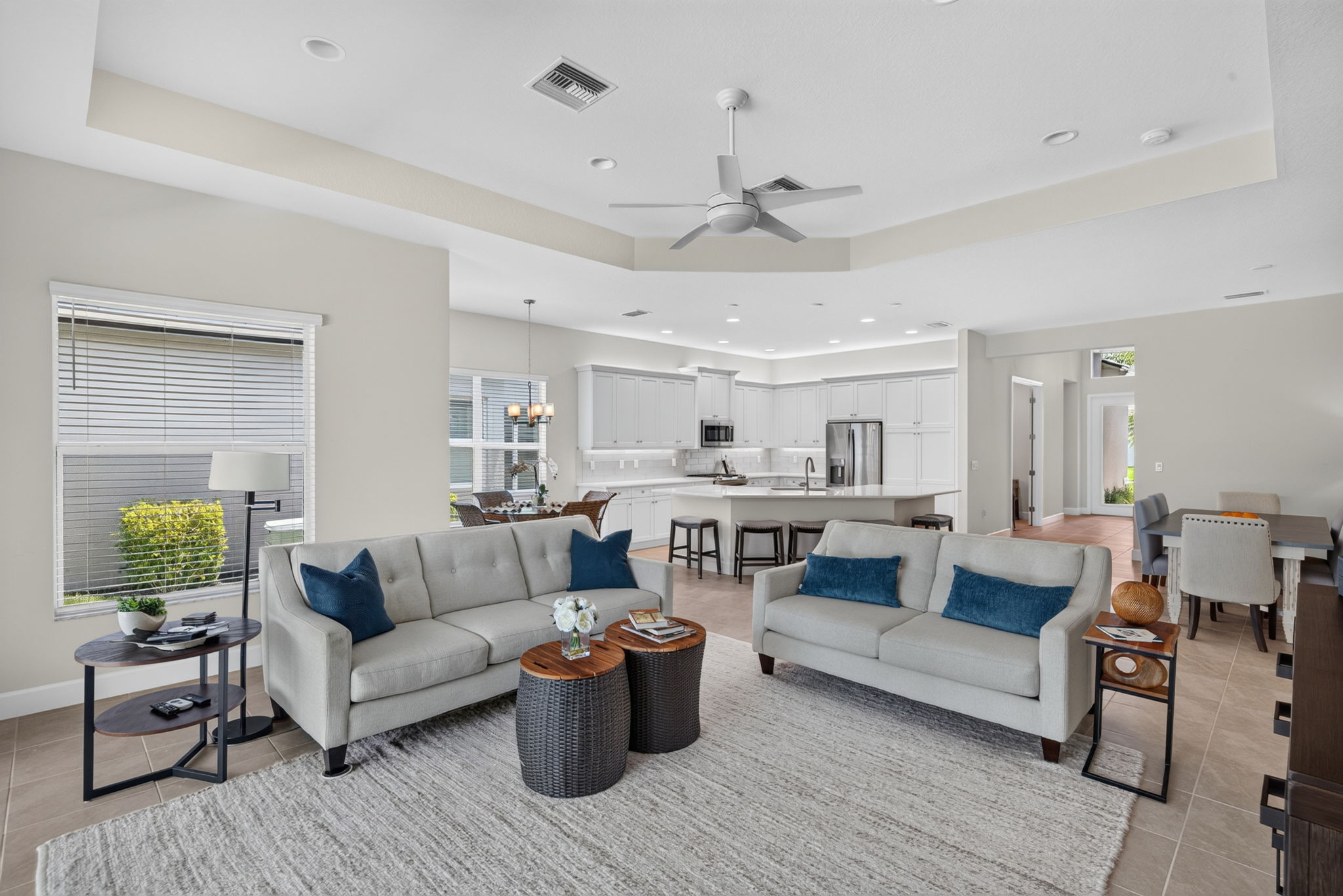 View from pool sliders into the living areas in rear of home of great rm, dining area, breakfast rm, and kitchen! Very popular floor plan!