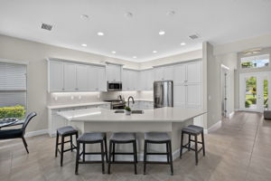 Quartz countertops, seating for 5 at bar, large pantry, and above and below cabinetry lighting are all yours to enjoy!