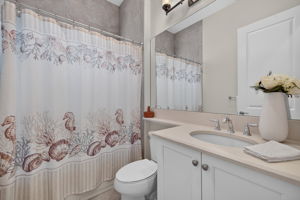 All 3 full baths feature to the ceiling tile upgrade! This one is the shared bath to the right of the foyer and adjacent to the 3rd bedroom.