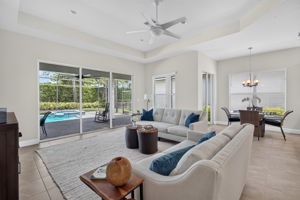 The generous sized great room features a tray ceiling, 3 sliders plus 2 windows! Private rear yard, too!
