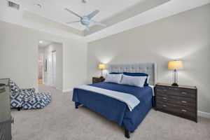 This view highlights the gorgeous tray ceiling! Bed shown is a king sized bed; night stands are large, too.