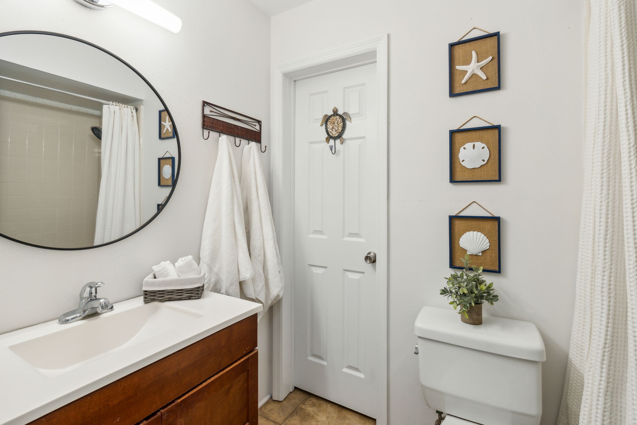 The guest bath also features a full shower/tub combo...