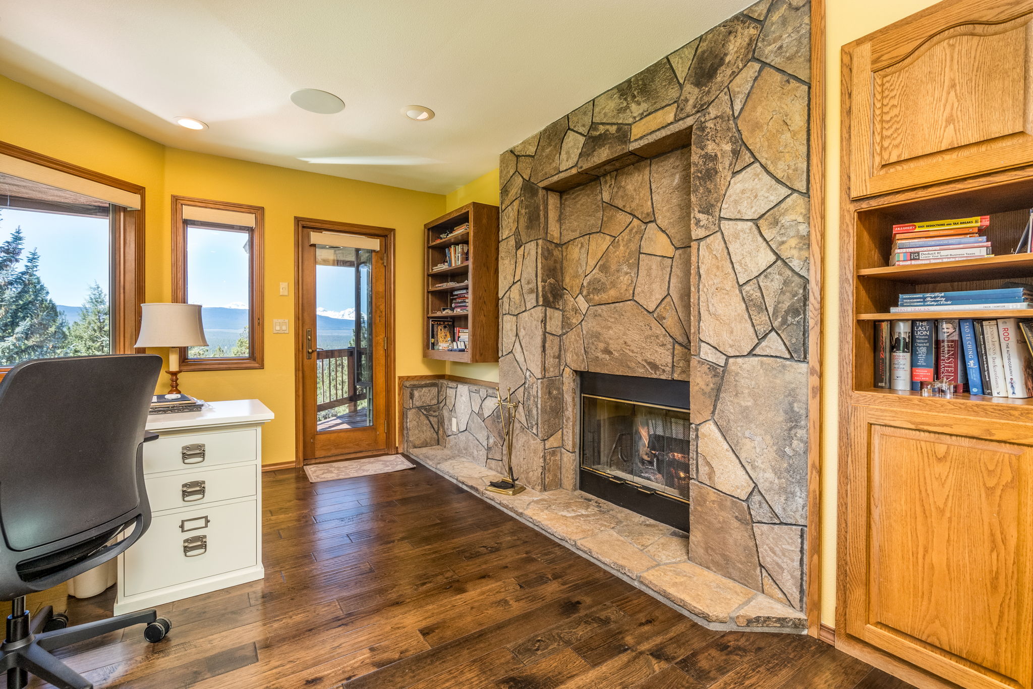 Wood-burning fireplace in office and primary suite