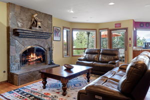 curl up in the cozy family room next to the wood-burning fire place