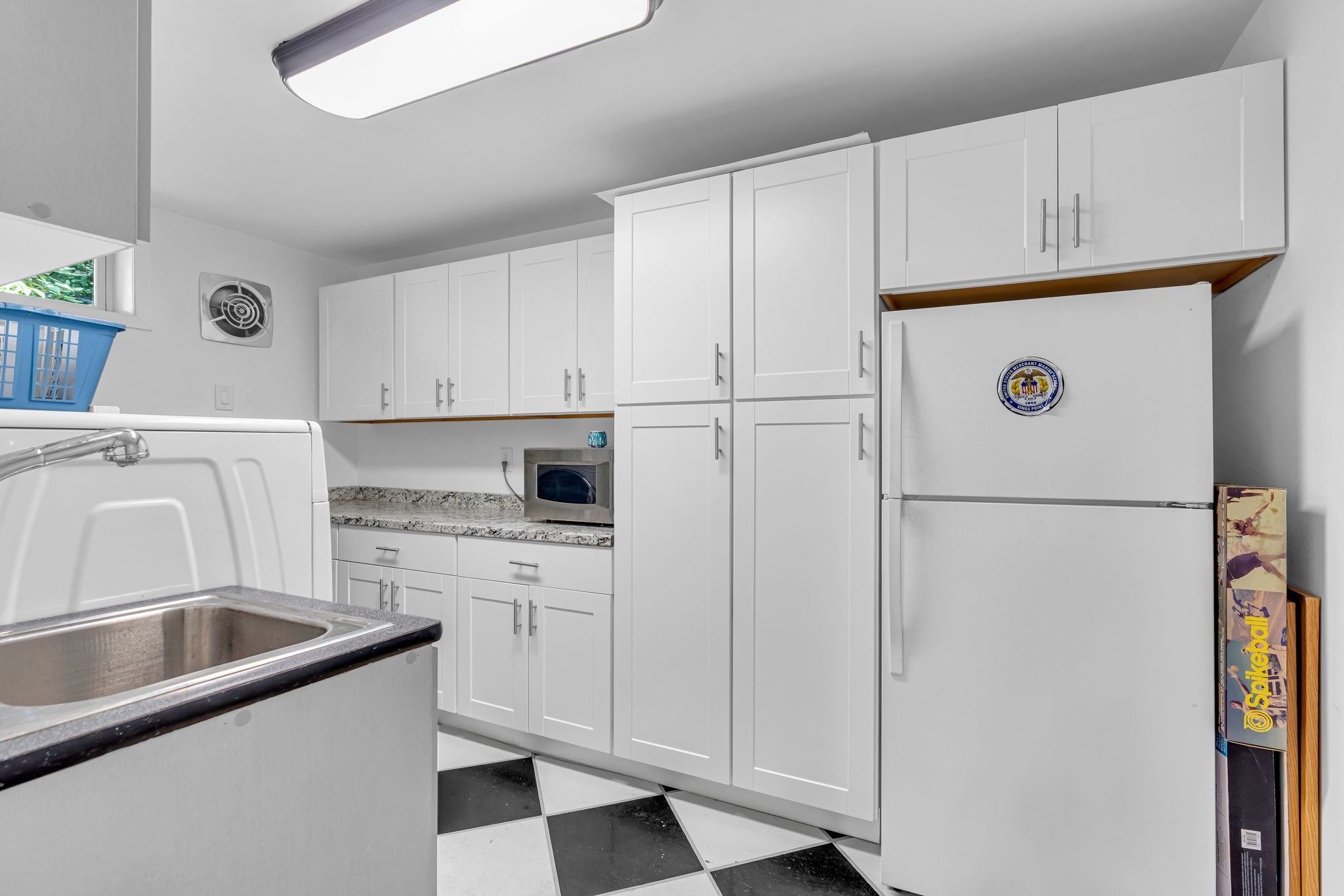 Laundry room, built-in cabinetry, utility sink, 2nd refrigerator