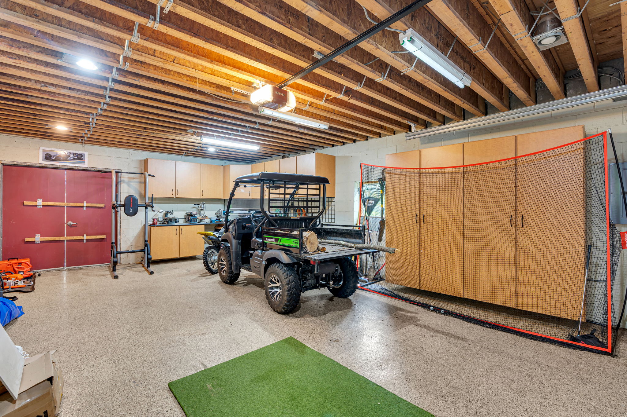 Inside detached barn/garage, room for cars and storage