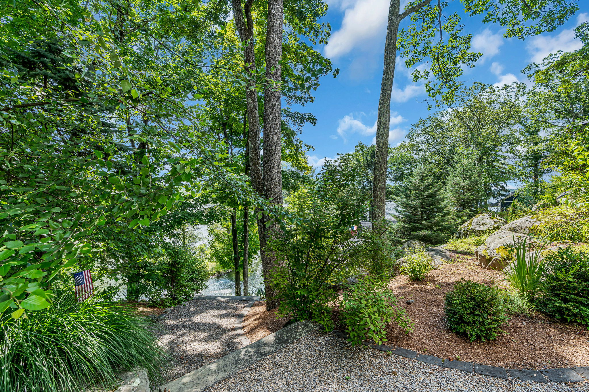View to drive down path to the lakeside retreat