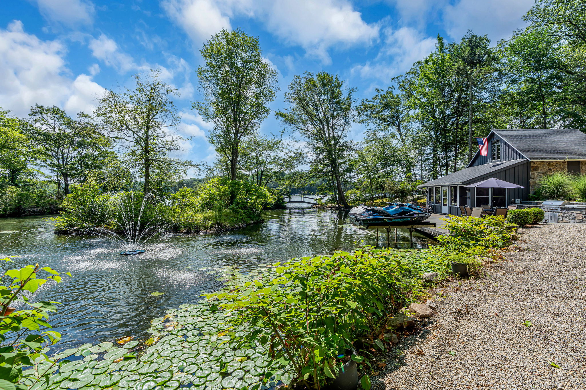 Walking path to lakefront cabana and outdoor kitchen