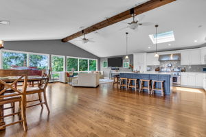 Spacious open floor plan, exposed beam, hardwood flooring, recessed lighting