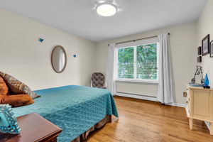Bedroom #2, wood flooring, custom blinds, double closet, views to lake!