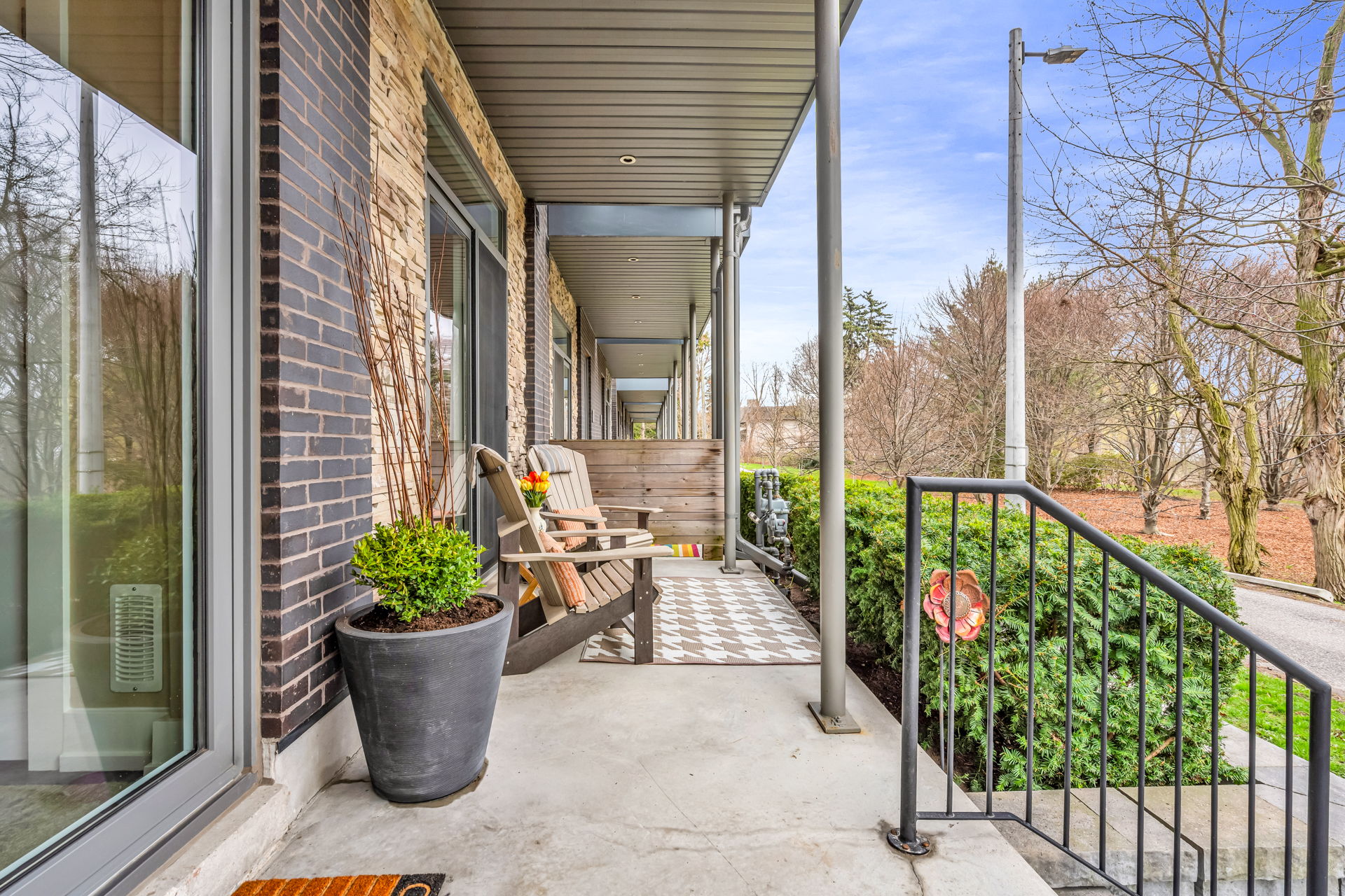 Generous front porch facing Rhododendron Gardens