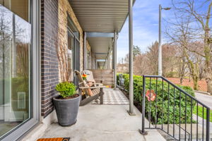 Generous front porch facing Rhododendron Gardens
