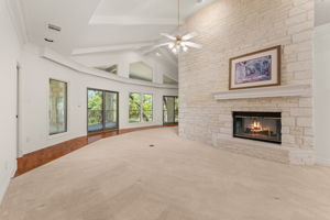 Formal living with fireplace looking towards golf course