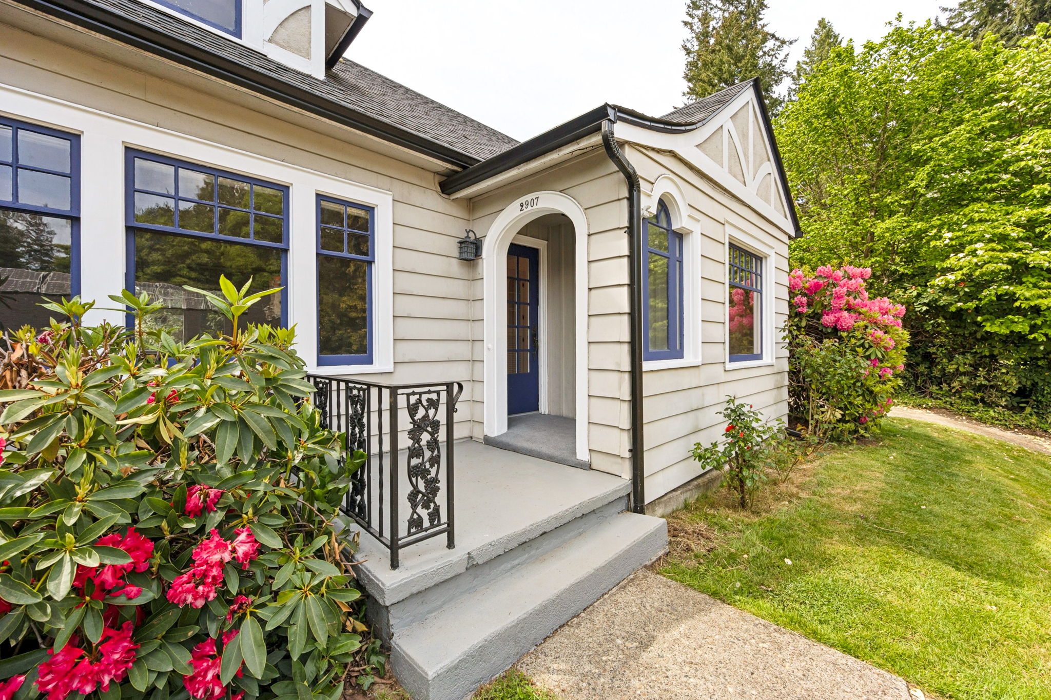Charming arched covered front entry.