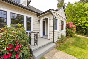 Charming arched covered front entry.