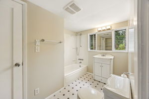 Full bathroom upstairs with shower/tub combo.