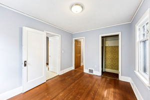 Main floor bedroom has access from hallway or kitchen.