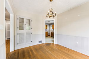 Dining room looking towards kitchen. Check out that built-in. So cute!