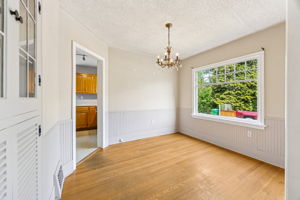 Super charming dining room with wainscoting and a classic built-in.