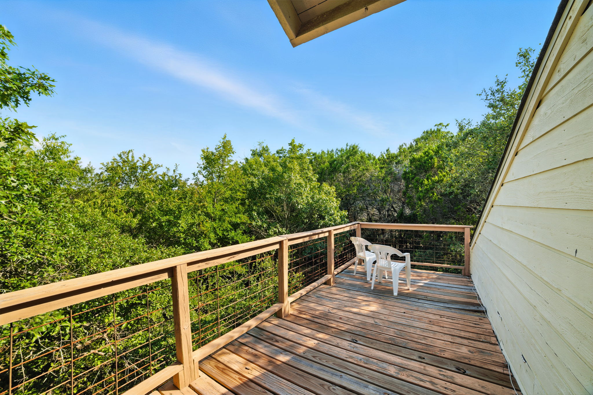 The expansive upstairs back patio offers a private perch among the treetops, creating the perfect spot for morning coffee, evening gatherings, or simply unwinding with a view. Surrounded by nature yet located in Eanes ISD near Lake Austin, it blends relaxation with convenience.
