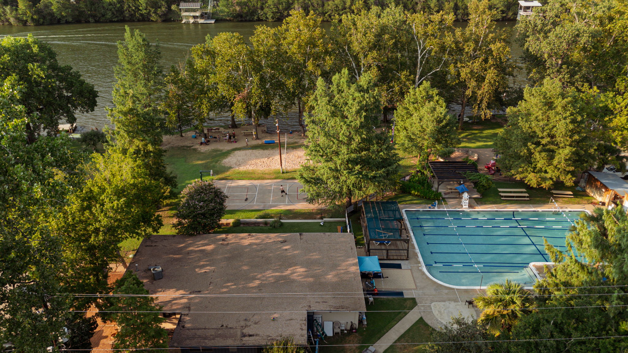 An overhead look at the Lake Hills Community Association, where the lake and surrounding amenities create a lifestyle that feels like an extension of home. Whether it’s a day on the water, an afternoon at the pool, or simply relaxing under the trees at one of the picnic areas, these optional features capture the balance of convenience and leisure that make this neighborhood so unique.