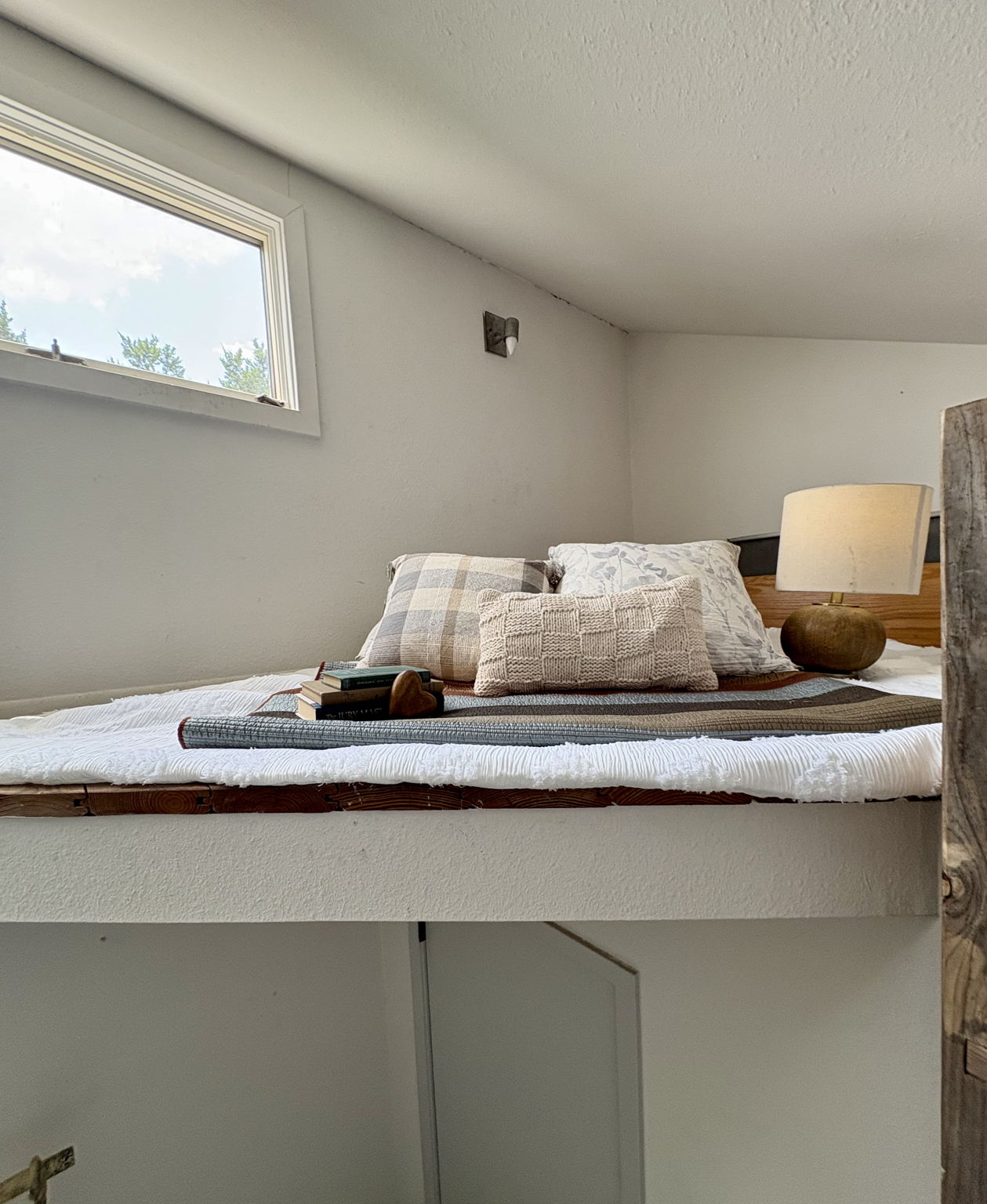 Tucked above the primary bedroom, this private loft offers a cozy retreat perfect for meditation, reading, or quiet reflection. With natural light streaming in from the window, it’s a distinctive feature that adds character and versatility to the home.