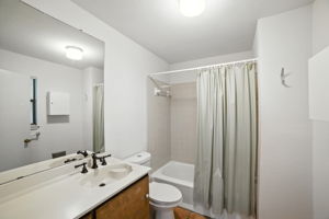 Located just off the back entrance, this full bathroom offers convenience for both residents and guests. With a tub-shower combo, clean finishes, and easy access from the living areas and patio, it’s designed to handle everyday needs with practicality and ease.
