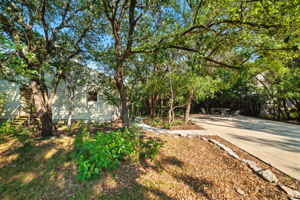 A long, private driveway leads to this treehouse-style home tucked among mature trees on a spacious 0.68-acre lot. The serene setting provides exceptional privacy and a true Austin retreat feel, while still being just steps from Lake Austin and within the highly acclaimed Eanes ISD.
