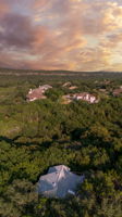 Breathtaking Hill Country sunsets frame this private retreat, tucked deep into a canopy of mature trees. The home sits quietly back from the street, offering unmatched privacy while still being just minutes from Lake Austin and in the highly acclaimed Eanes ISD.