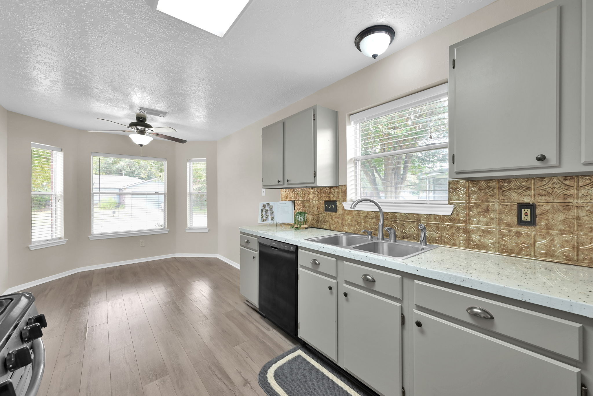 This is a partial shot of the kitchen showing the BREAKFAST AREA (10' x 9') on the other end.