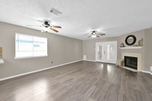 This view you see upon entering the home. The French doors seen in the photo lead to the rear (14' x 10') "Bonus Room" addition (* INCLUDED AS PART OF THE TOTAL 1,598 SF FOR THIS PROPERTY *).