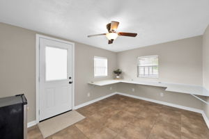 This photo shows the rear home addition "BONUS ROOM" located off of the main living area. Offers so many potential uses!