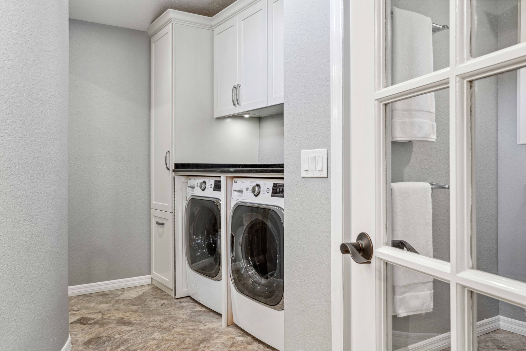Primary Bath - custom built-in cabinets for washer/dryer