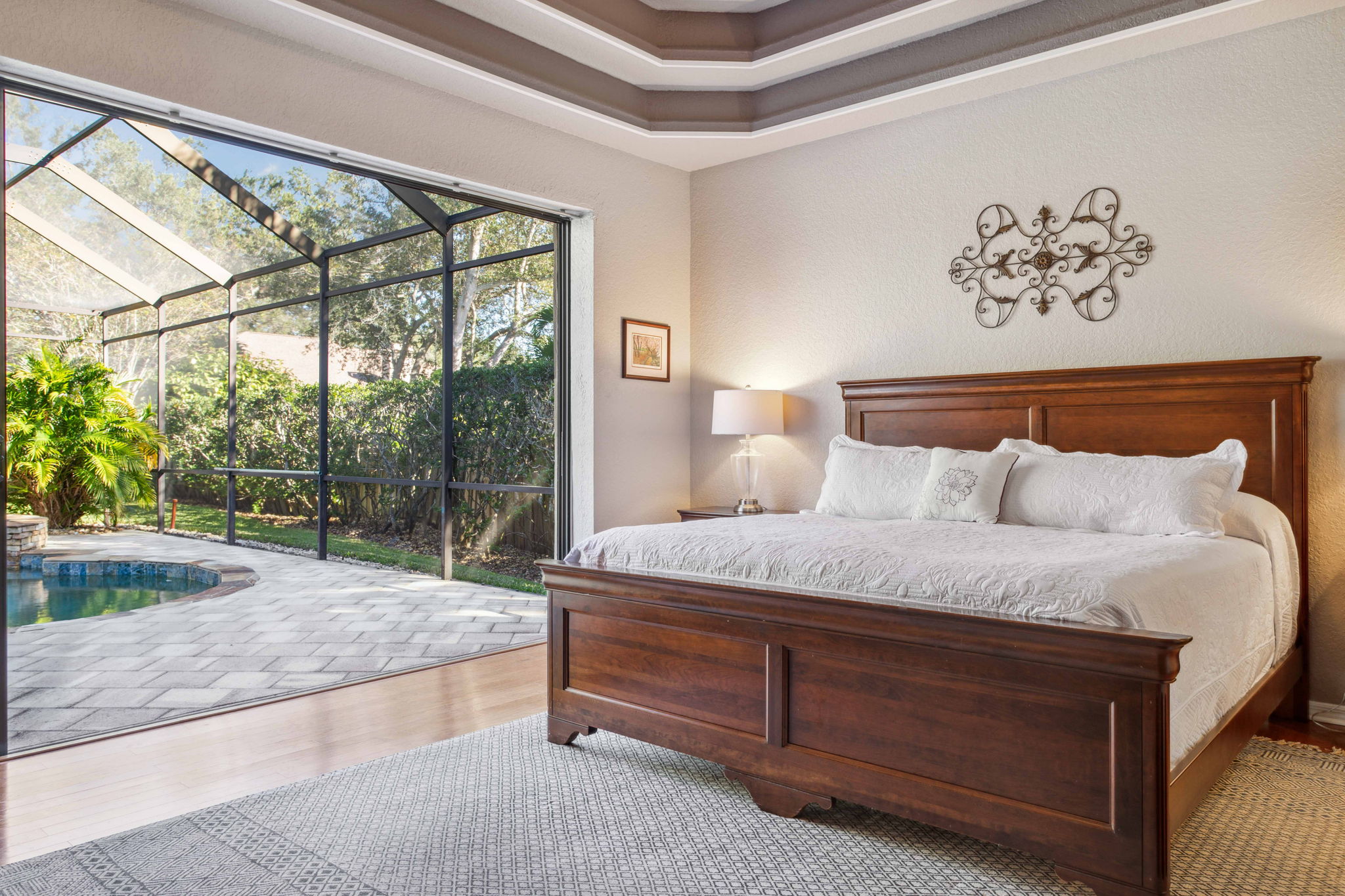 Stunning Primary Bedroom with pocket sliders leading to lanai
