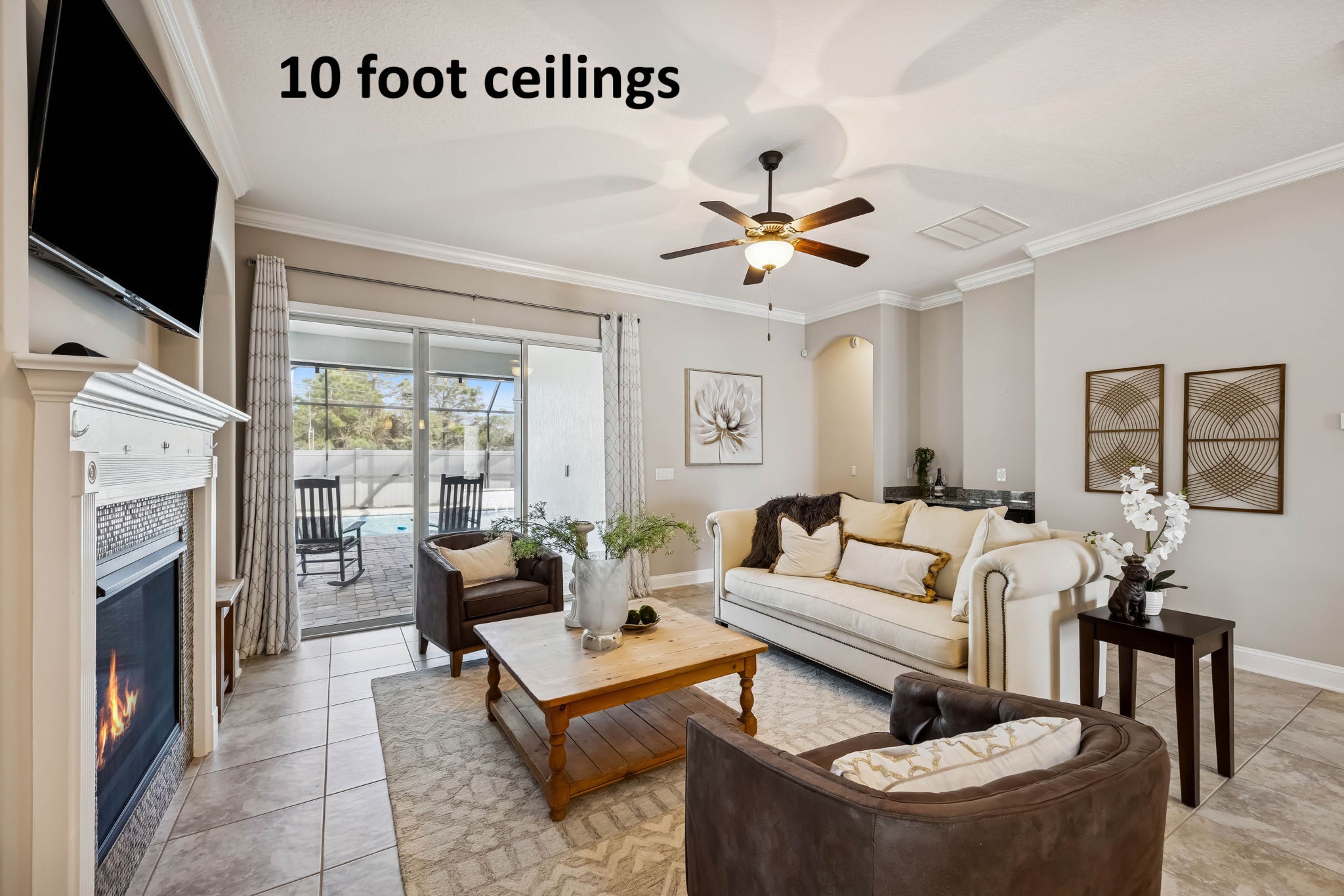 With 10' ceilings and expansive light-toned tile underfoot, the home feels bright and open ...
