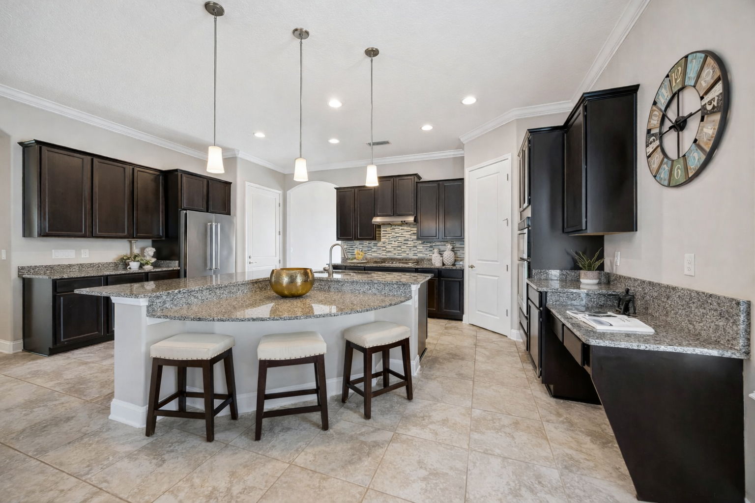 A substantial center island provides seating for five to six ...