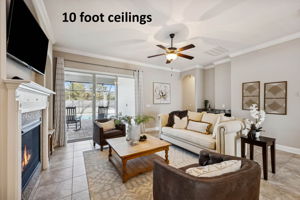 With 10' ceilings and expansive light-toned tile underfoot, the home feels bright and open ...