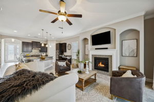 Opening to the kitchen, the living room feels connected yet comfortably defined ...