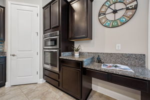 ... while a built-in desk area adds flexibility for household organization, remote work, or keeping daily tasks tucked neatly within reach