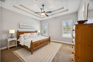 ... the primary suite offers generous proportions that easily accommodates a king-size bed along with multiple dressers