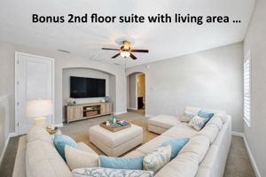 The private second-floor bonus suite begins with its own comfortable living area, creating a flexible retreat away from the main level ...