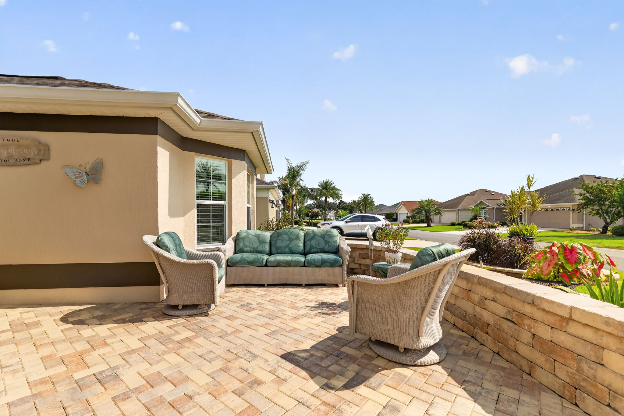 Spacious Front Paver Patio with Knee-High Wall