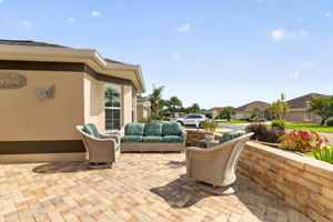 Spacious Front Paver Patio with Knee-High Wall