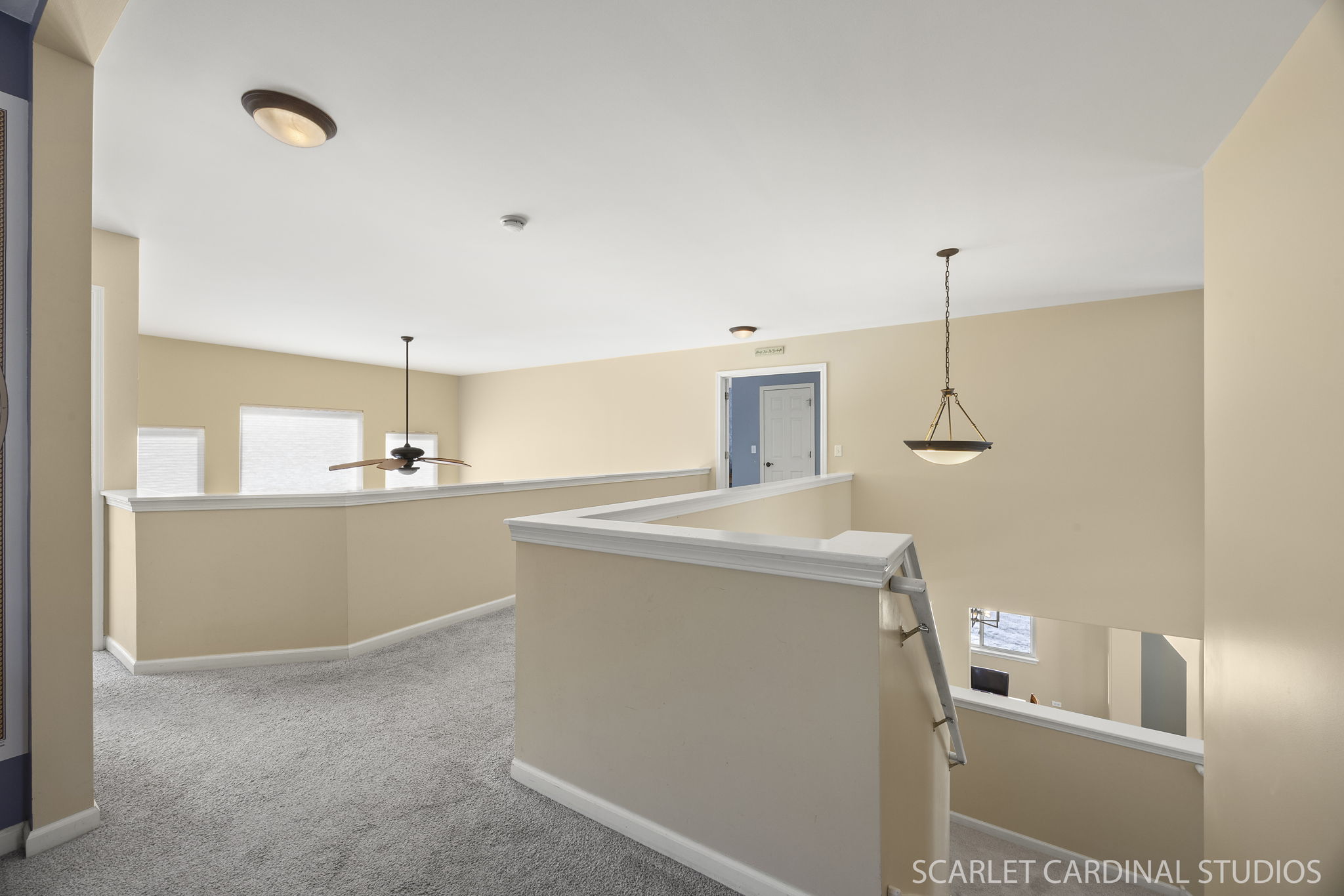 Catwalk with views of 2-story living and family rooms...