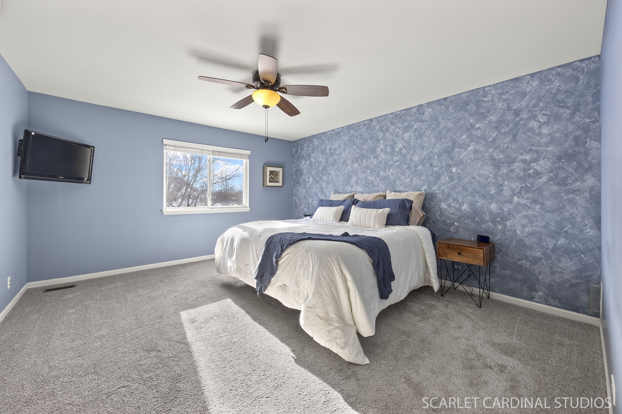 Primary bedroom with custom walk-in closet & private spa-bath