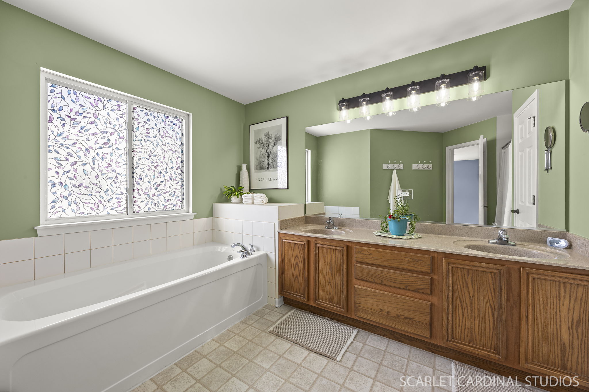 Spacious primary bath with dual-sink vanity, soaking tub & separate shower...